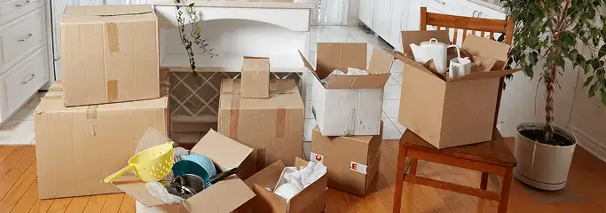 Packed moving boxes and household items in a kitchen before move-out or move-in cleaning, Scottsdale, AZ.